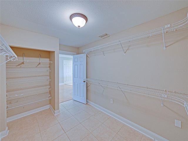 4230 Viola Rd, Lakeland, FL 33810 - spacious closet featuring tile patterned flooring