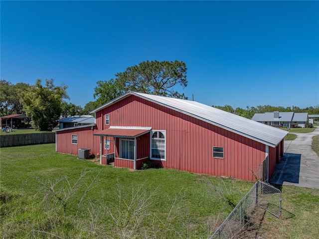 4230 Viola Rd, Lakeland, FL 33810 - back of house featuring an outbuilding, a metal roof, and an outdoor structure