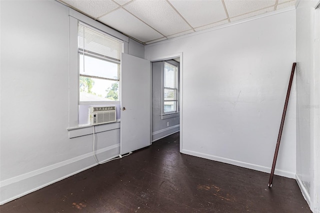 121 F Ave SW, Winter Haven, FL 33880 - unfurnished room with a drop ceiling and wood finished floors