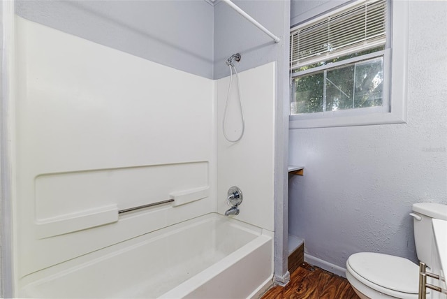 121 F Ave SW, Winter Haven, FL 33880 - full bathroom featuring shower / tub combination and wood finished floors