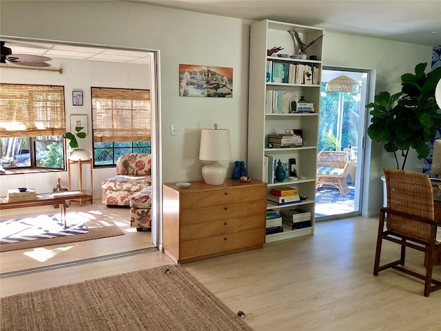 4718 Crystal Ave, Sarasota, FL 34231 - living area with healthy amount of natural light, light wood-style floors, and ceiling fan