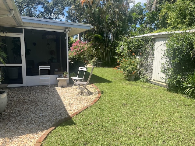 4718 Crystal Ave, Sarasota, FL 34231 - view of green lawn with a sunroom