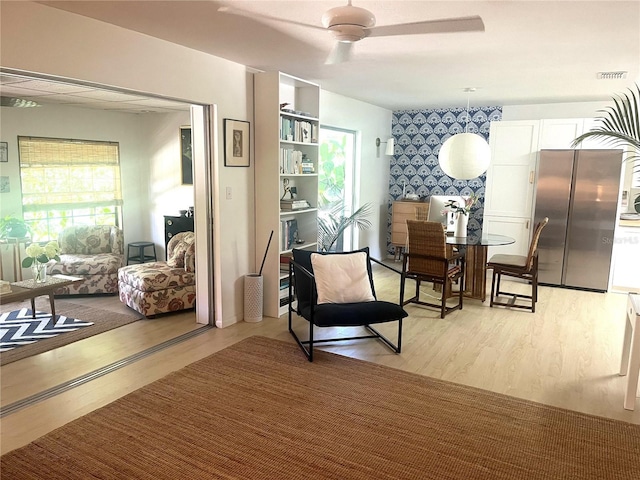 4718 Crystal Ave, Sarasota, FL 34231 - living area featuring a ceiling fan and light wood-style flooring