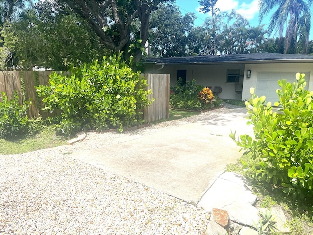 4718 Crystal Ave, Sarasota, FL 34231 - view of patio / terrace with a garage and concrete driveway