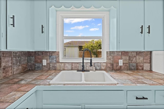 275 Garden Rd, Venice, FL 34293 - kitchen with tile countertops, white cabinets, and decorative backsplash