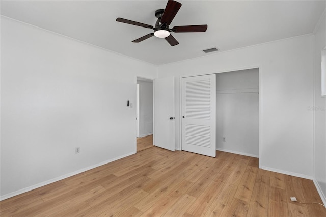 275 Garden Rd, Venice, FL 34293 - unfurnished bedroom with light wood-type flooring, a closet, crown molding, and a ceiling fan