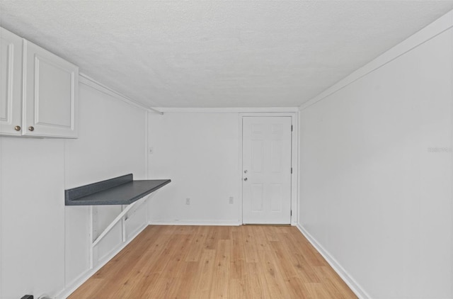 275 Garden Rd, Venice, FL 34293 - spare room with light wood-style floors and a textured ceiling