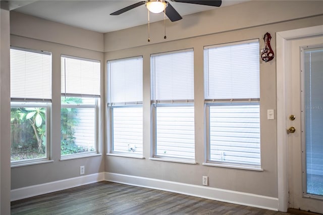 3542 Raintree Ct, Lakeland, FL 33803 - unfurnished sunroom featuring baseboards and wood finished floors