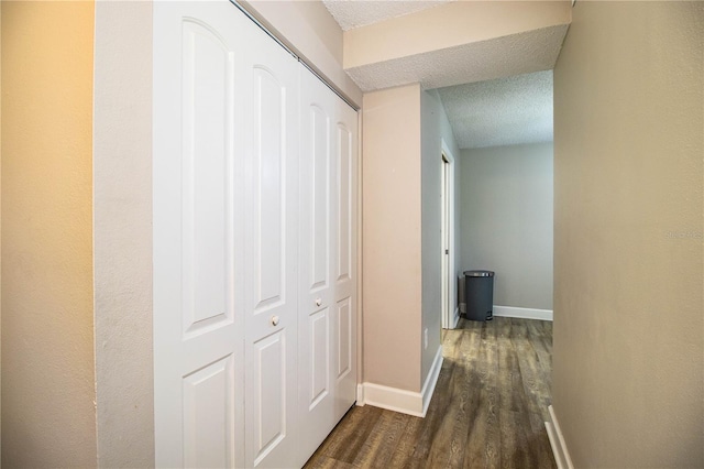 3542 Raintree Ct, Lakeland, FL 33803 - corridor featuring a textured ceiling and dark wood-type flooring