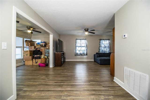 3542 Raintree Ct, Lakeland, FL 33803 - living area featuring ceiling fan, healthy amount of natural light, dark wood-style flooring, and a textured ceiling