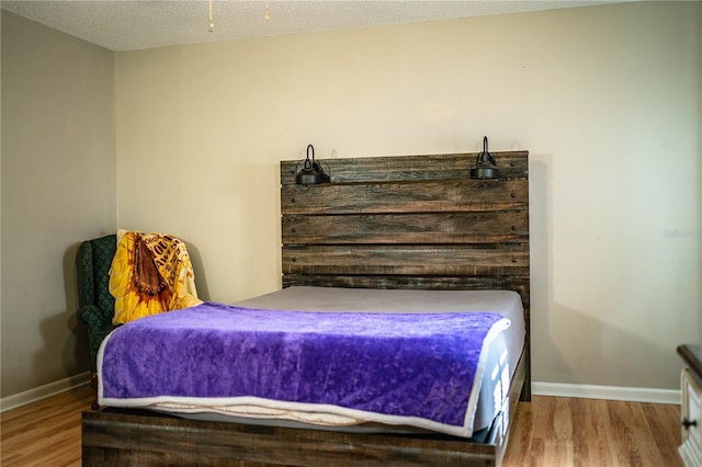 3542 Raintree Ct, Lakeland, FL 33803 - bedroom featuring wood finished floors and baseboards