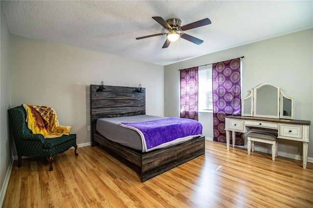 3542 Raintree Ct, Lakeland, FL 33803 - bedroom featuring light wood-type flooring, a textured ceiling, and a ceiling fan