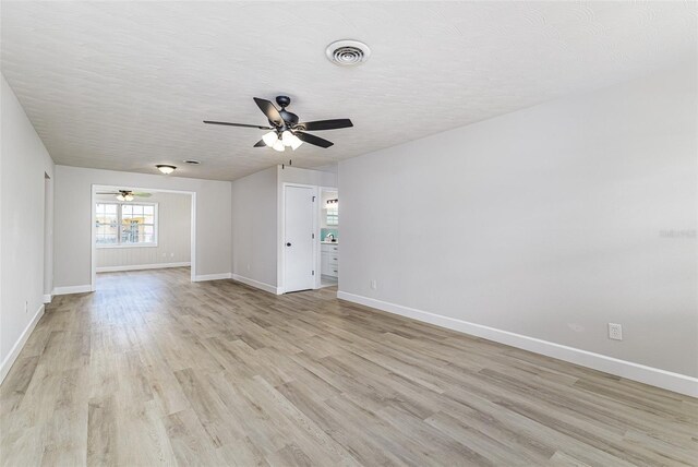 508 Boger Blvd N, Lakeland, FL 33803 - unfurnished room featuring ceiling fan, light wood-type flooring, and a textured ceiling