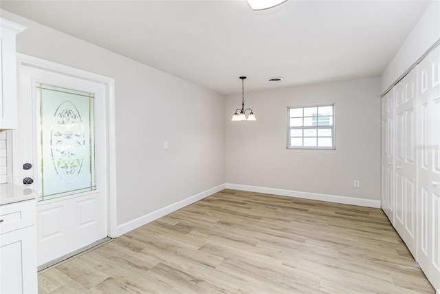 508 Boger Blvd N, Lakeland, FL 33803 - foyer entrance featuring a chandelier and light wood-type flooring