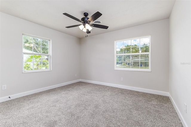508 Boger Blvd N, Lakeland, FL 33803 - empty room featuring plenty of natural light, carpet flooring, and ceiling fan