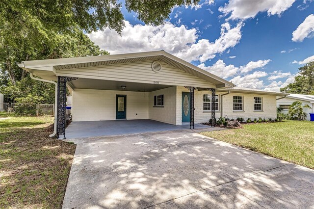 508 Boger Blvd N, Lakeland, FL 33803 - ranch-style house featuring concrete driveway and a carport