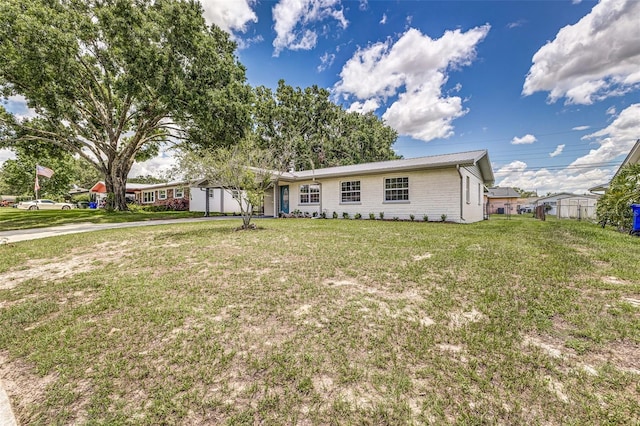 508 Boger Blvd N, Lakeland, FL 33803 - ranch-style home with a front lawn, driveway, and a metal roof
