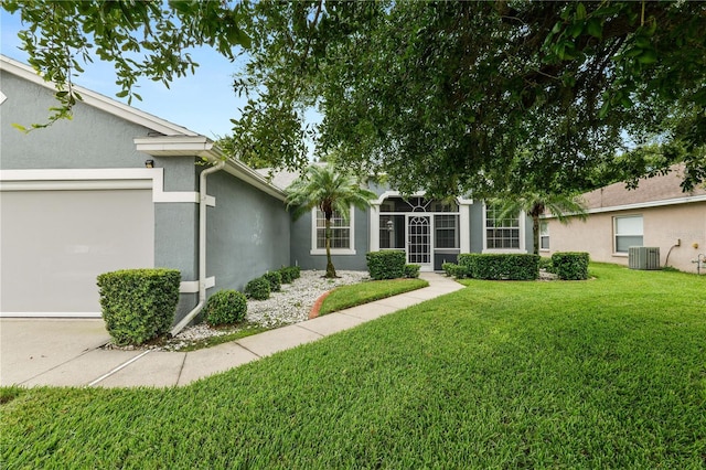 4242 Whistlewood Cir, Lakeland, FL 33811 - view of grassy yard with a garage