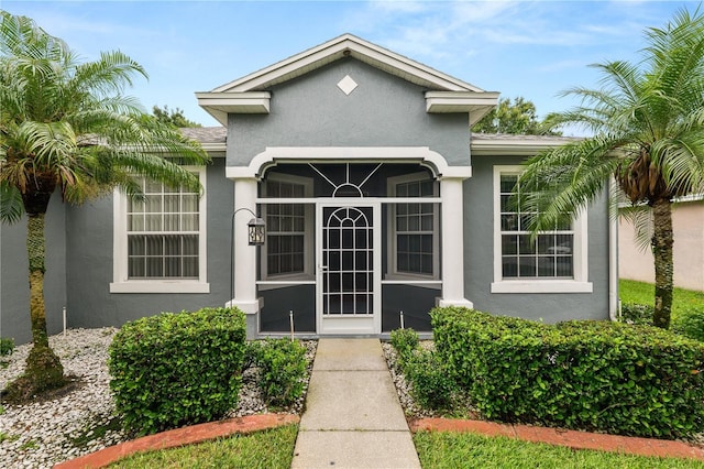 4242 Whistlewood Cir, Lakeland, FL 33811 - doorway to property featuring stucco siding