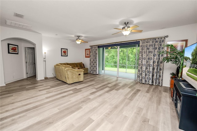 4242 Whistlewood Cir, Lakeland, FL 33811 - living room with ceiling fan, light wood-type flooring, and arched walkways