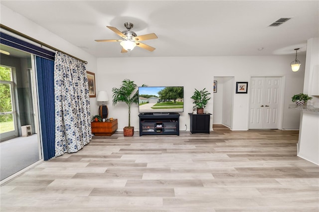 4242 Whistlewood Cir, Lakeland, FL 33811 - unfurnished living room with ceiling fan and light wood-style flooring
