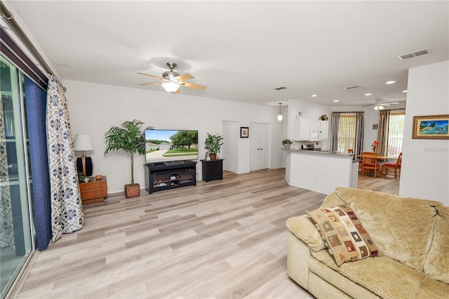 4242 Whistlewood Cir, Lakeland, FL 33811 - living area with a ceiling fan, light wood-style floors, and recessed lighting