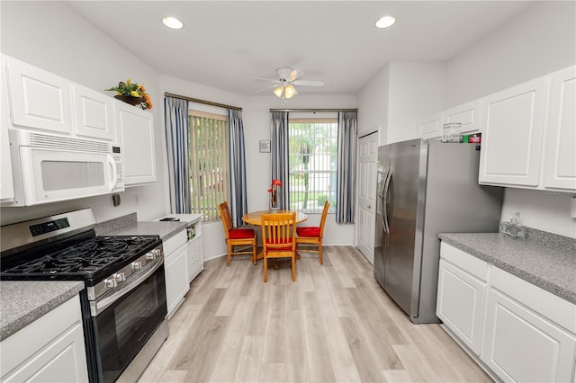 4242 Whistlewood Cir, Lakeland, FL 33811 - kitchen featuring appliances with stainless steel finishes, light wood-style flooring, ceiling fan, recessed lighting, and white cabinets