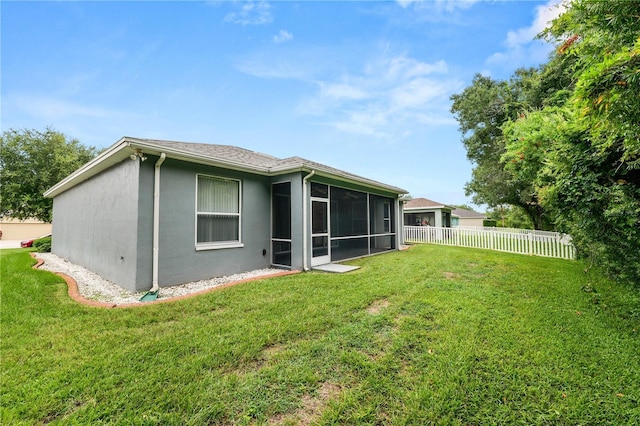 4242 Whistlewood Cir, Lakeland, FL 33811 - back of property featuring a sunroom and stucco siding