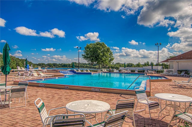 4242 Whistlewood Cir, Lakeland, FL 33811 - community pool featuring a patio area