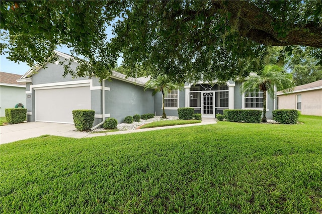 4242 Whistlewood Cir, Lakeland, FL 33811 - view of front of house featuring stucco siding, an attached garage, a front yard, and concrete driveway