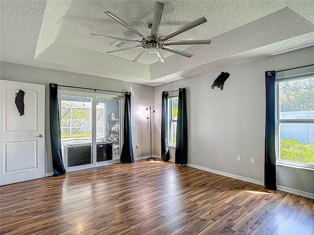 173 Portland Ave, Spring Hill, FL 34606 - spare room featuring a textured ceiling, wood finished floors, healthy amount of natural light, and a ceiling fan