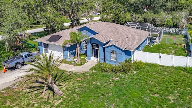 173 Portland Ave, Spring Hill, FL 34606 - view of front of home featuring a fenced backyard, driveway, and stucco siding
