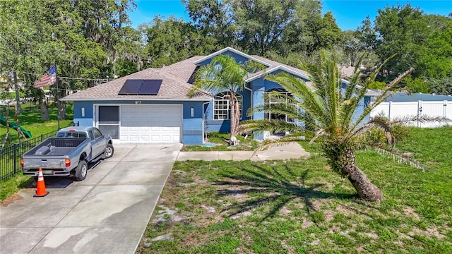 173 Portland Ave, Spring Hill, FL 34606 - ranch-style house with stucco siding, solar panels, roof with shingles, a garage, and concrete driveway