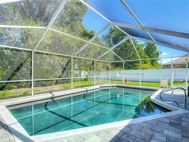 173 Portland Ave, Spring Hill, FL 34606 - view of swimming pool featuring a fenced backyard, glass enclosure, and a patio
