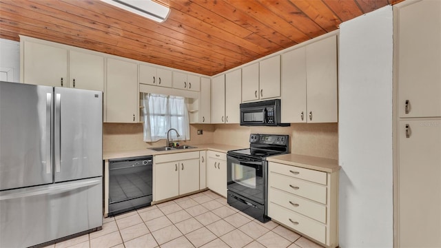 712 N Gary Rd, Lakeland, FL 33801 - kitchen featuring black appliances, wooden ceiling, light countertops, and light tile patterned flooring