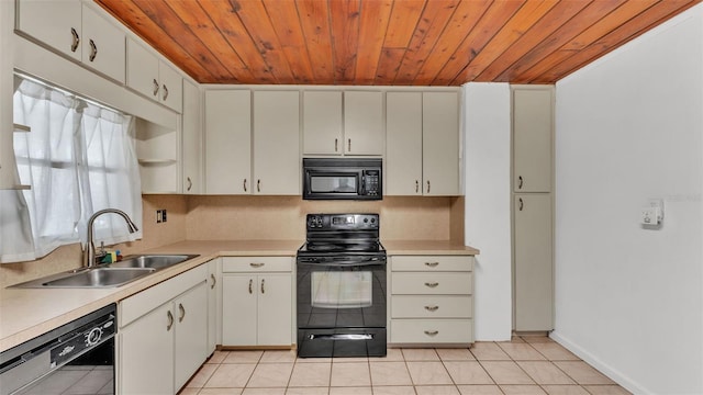712 N Gary Rd, Lakeland, FL 33801 - kitchen featuring black appliances, wood ceiling, light countertops, light tile patterned flooring, and white cabinetry