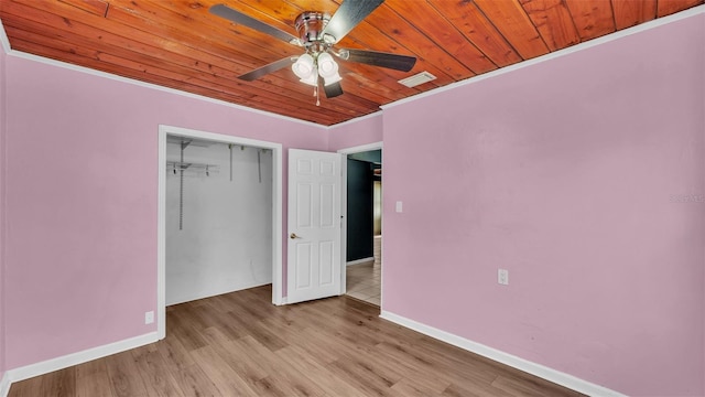 712 N Gary Rd, Lakeland, FL 33801 - unfurnished bedroom with wood ceiling, a closet, a ceiling fan, light wood-style flooring, and crown molding