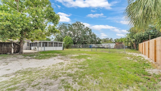 712 N Gary Rd, Lakeland, FL 33801 - fenced backyard featuring a sunroom