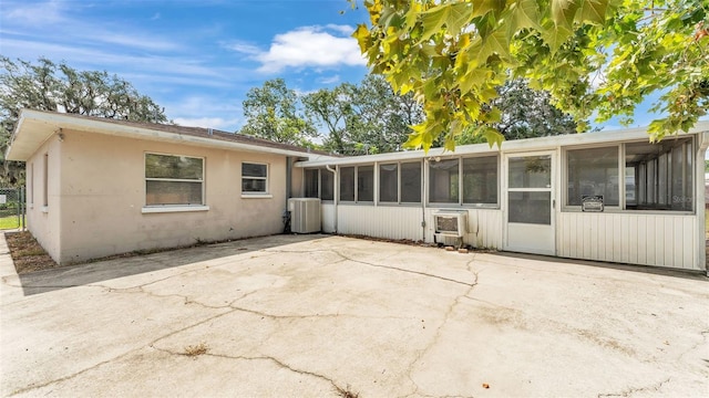 712 N Gary Rd, Lakeland, FL 33801 - view of home's exterior with a sunroom, a patio area, and stucco siding