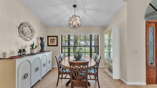 5819 Hollyhock Dr, Lakeland, FL 33813 - dining room featuring healthy amount of natural light, a chandelier, and light tile patterned flooring