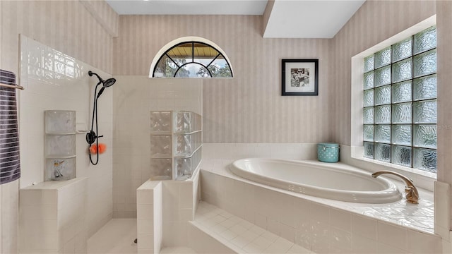 5819 Hollyhock Dr, Lakeland, FL 33813 - bathroom featuring wallpapered walls, a garden tub, and a walk in shower