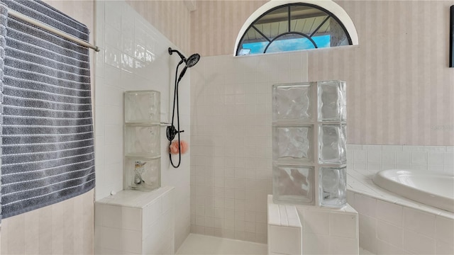 5819 Hollyhock Dr, Lakeland, FL 33813 - bathroom with wallpapered walls, a walk in shower, and a garden tub