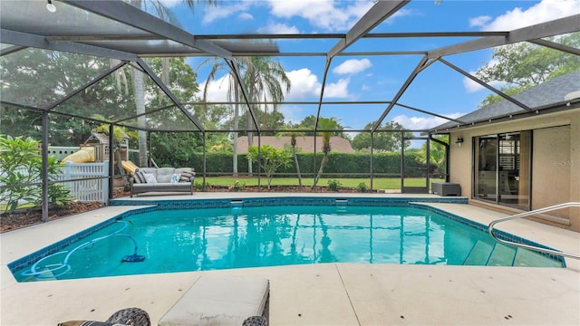 5819 Hollyhock Dr, Lakeland, FL 33813 - view of pool featuring a patio area, glass enclosure, and an outdoor hangout area