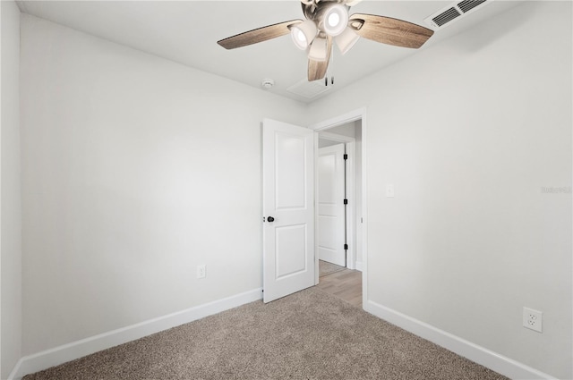 2633 Keysville Dr, Lithia, FL 33547 - empty room featuring light carpet, ceiling fan, and a smoke detector