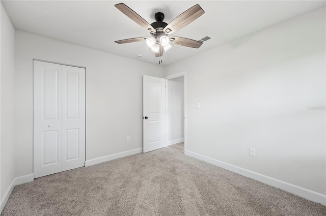 2633 Keysville Dr, Lithia, FL 33547 - unfurnished bedroom featuring carpet floors, a closet, and a ceiling fan