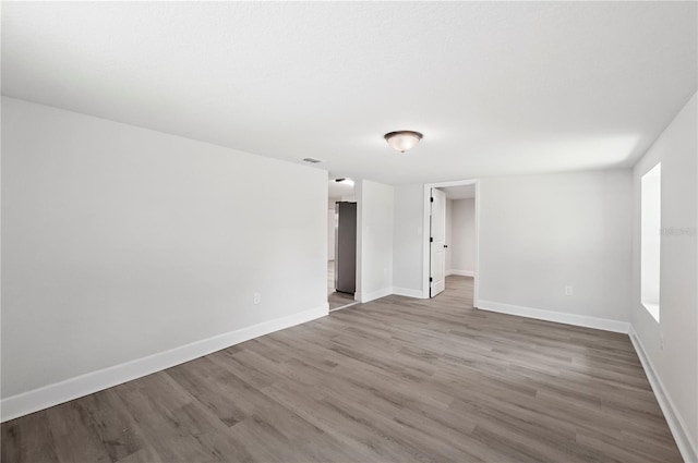 2633 Keysville Dr, Lithia, FL 33547 - unfurnished room with wood finished floors and baseboards