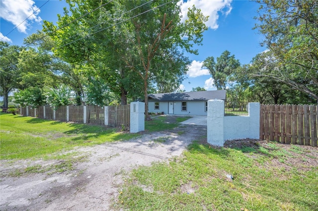 2633 Keysville Dr, Lithia, FL 33547 - fenced front yard with dirt driveway