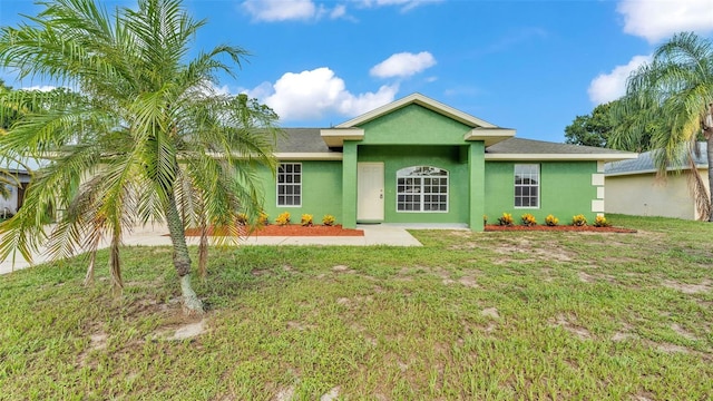 4515 Starfish Ave, Sebring, FL 33870 - ranch-style home featuring stucco siding and a front lawn