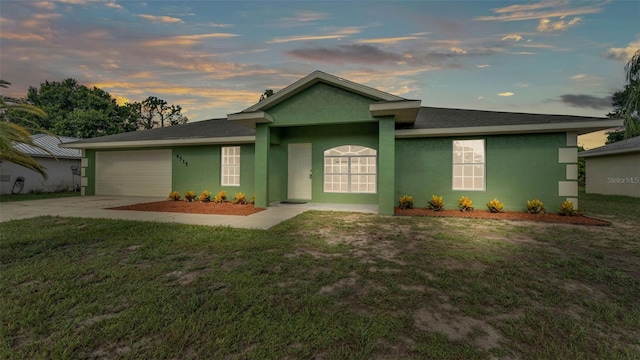 4515 Starfish Ave, Sebring, FL 33870 - single story home with concrete driveway, an attached garage, a front yard, and stucco siding