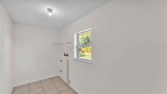 4515 Starfish Ave, Sebring, FL 33870 - laundry room with light tile patterned floors and baseboards